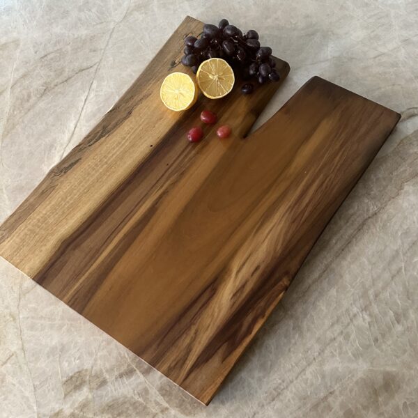 Handcrafted live edge poplar charcuterie board with a beautiful grain pattern that captures your eye.
